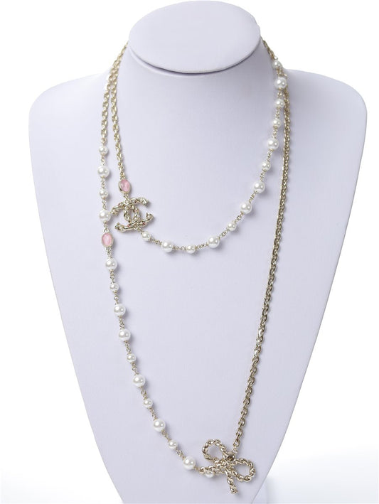 CHANEL long chain CC necklace gold with pearl bow